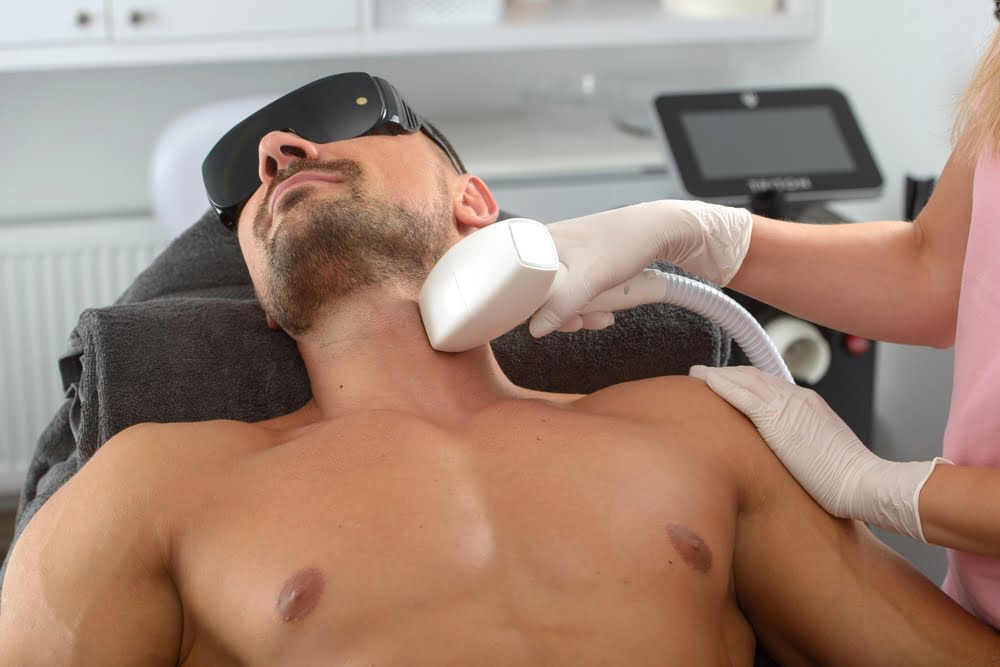 Laser,Hair,Removal,On,Mans,Neck.,Man,In,A,Goggles. Laser,Hair,Removal,On,Mans,Neck.,Man,In,A,Goggles.